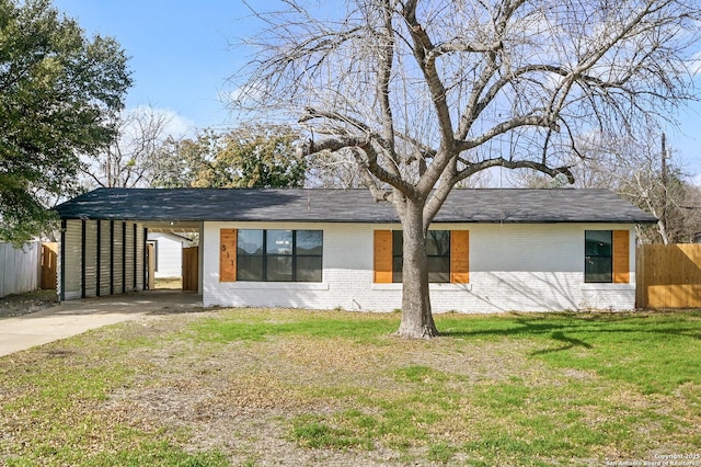 single story home featuring a front lawn and a carport