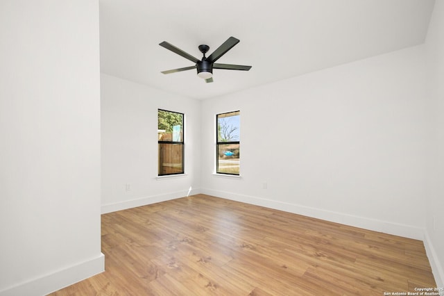 spare room featuring ceiling fan and light hardwood / wood-style floors