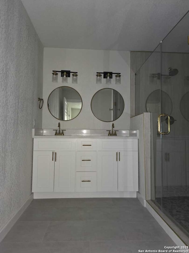 bathroom featuring an enclosed shower and vanity