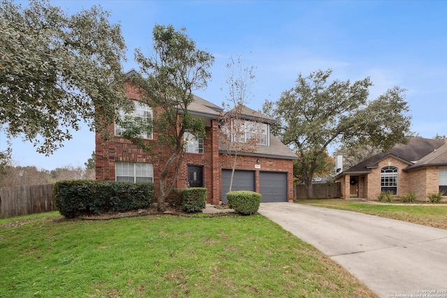 view of front of home with a garage and a front yard