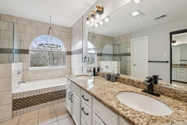 bathroom with vanity, independent shower and bath, and tile patterned flooring