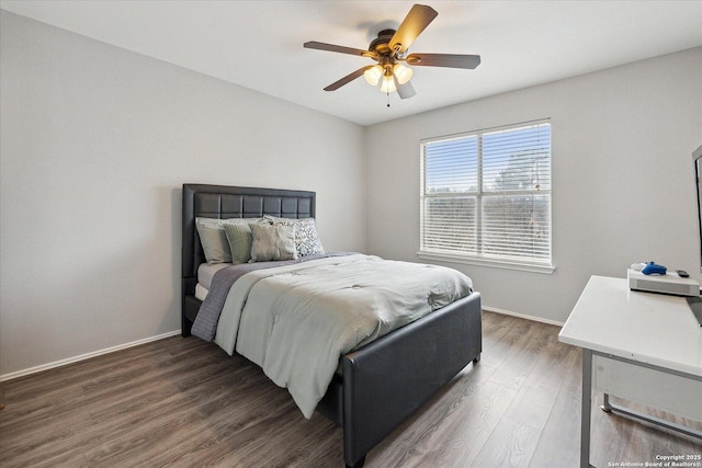 bedroom featuring dark wood-type flooring and ceiling fan