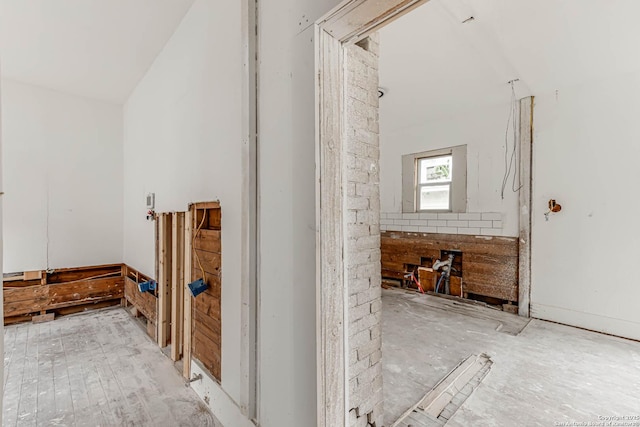 hall with lofted ceiling