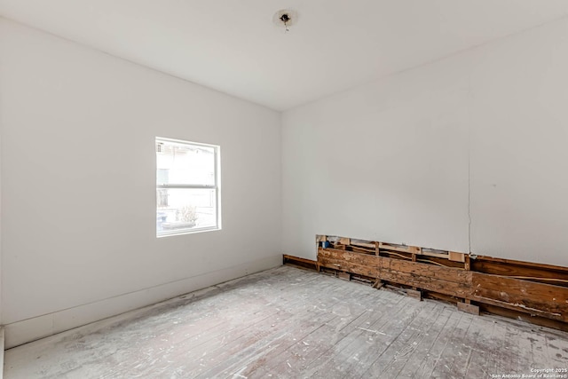 empty room featuring hardwood / wood-style flooring