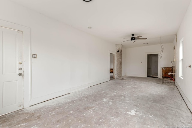 unfurnished living room featuring ceiling fan