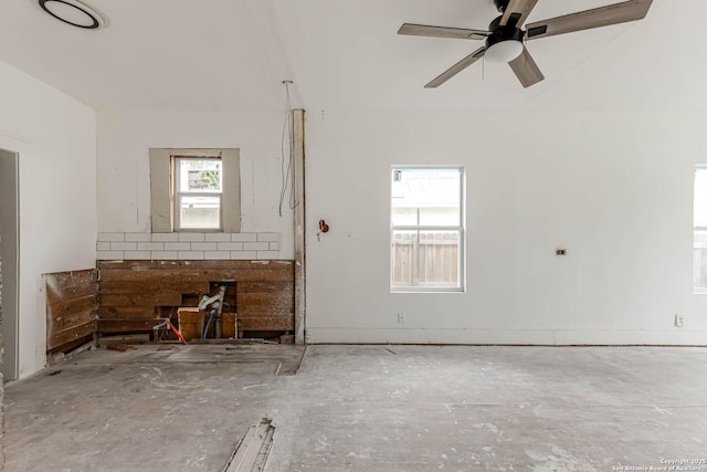 unfurnished living room with ceiling fan