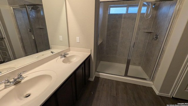 bathroom featuring vanity, hardwood / wood-style floors, and an enclosed shower