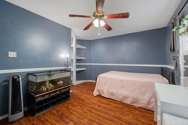 bedroom featuring hardwood / wood-style floors and ceiling fan