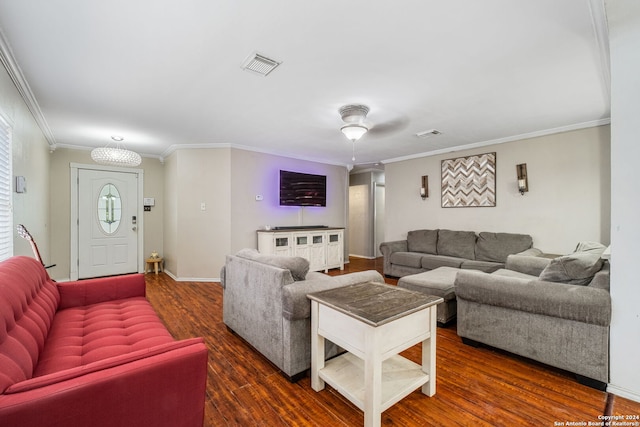 living room with ornamental molding and dark hardwood / wood-style flooring