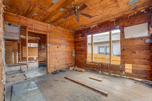 empty room with wooden ceiling and ceiling fan