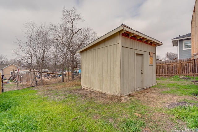 view of outbuilding featuring a yard