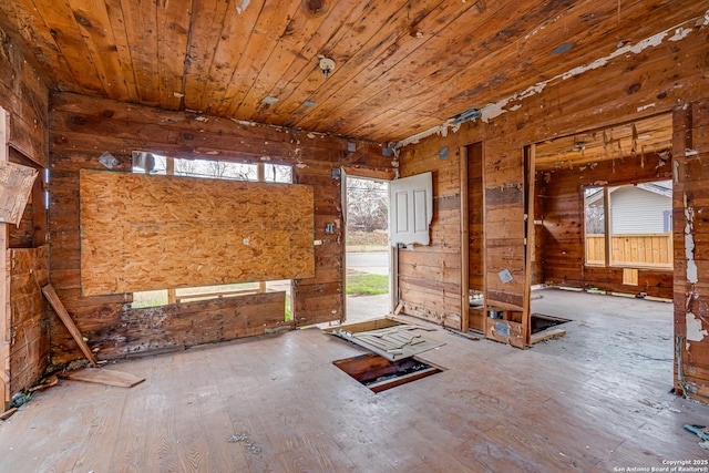 miscellaneous room featuring hardwood / wood-style floors, wooden ceiling, and wooden walls