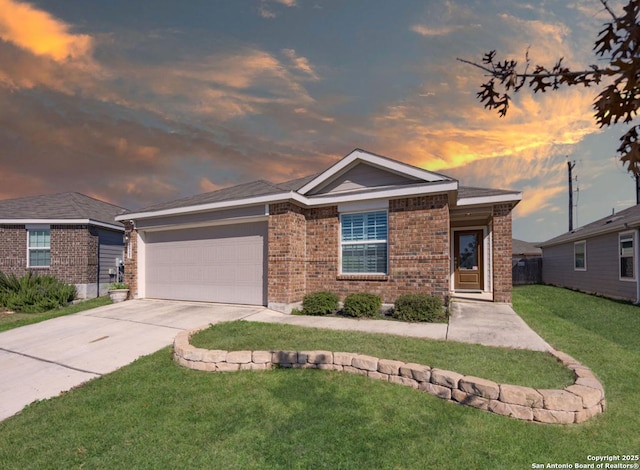 ranch-style house with a yard and a garage