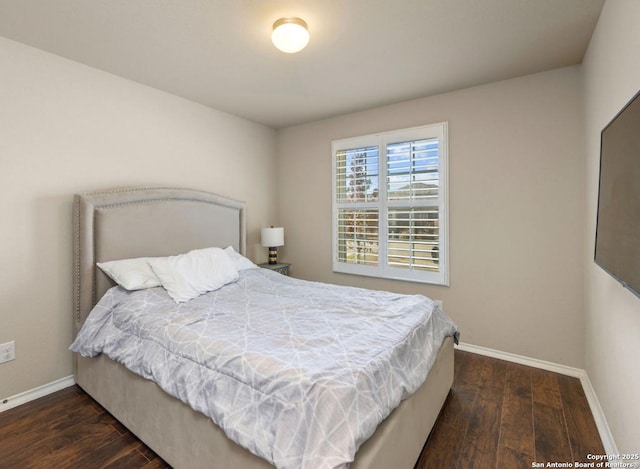 bedroom featuring dark hardwood / wood-style floors