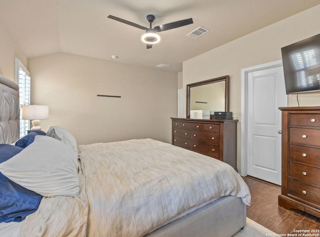 bedroom with ceiling fan and vaulted ceiling