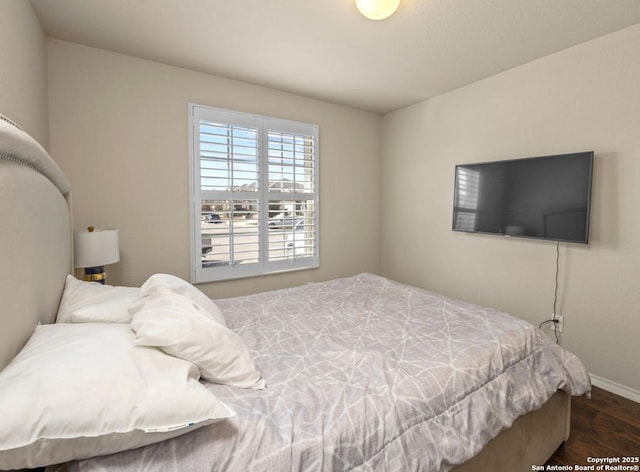 bedroom featuring dark wood-type flooring