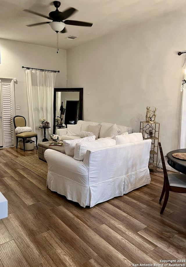 bedroom with ceiling fan and hardwood / wood-style floors