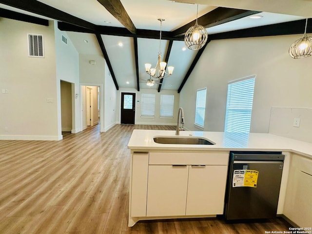 kitchen with dishwashing machine, sink, hanging light fixtures, a notable chandelier, and white cabinets