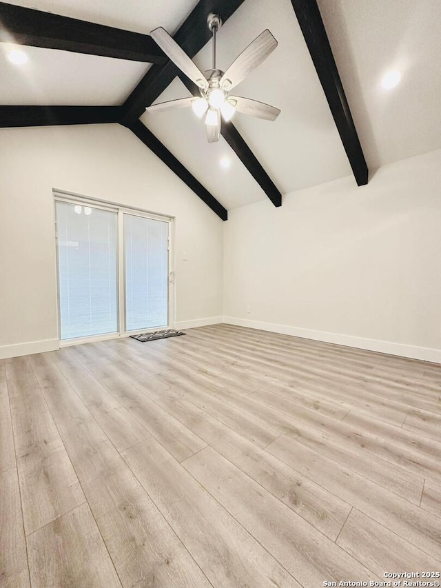 unfurnished room with ceiling fan, light wood-type flooring, and vaulted ceiling with beams