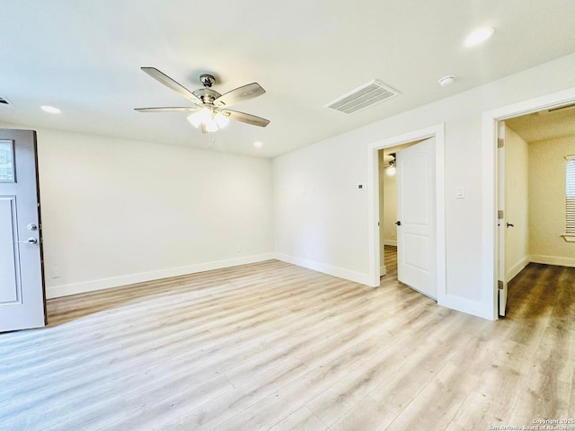 unfurnished room with ceiling fan and light hardwood / wood-style floors