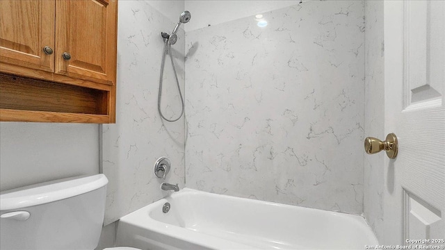 bathroom with shower / bathtub combination and toilet