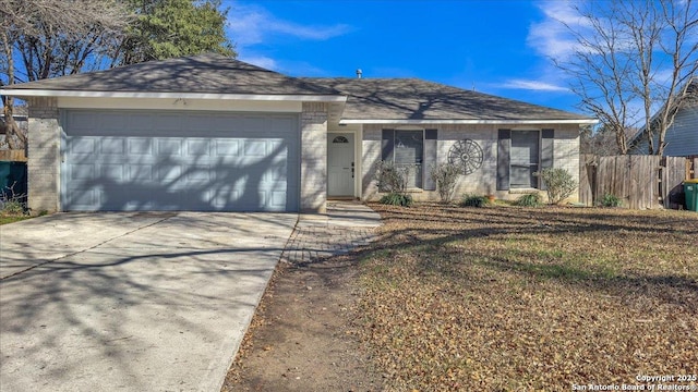 single story home featuring a garage