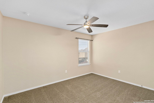 unfurnished room featuring ceiling fan and carpet flooring