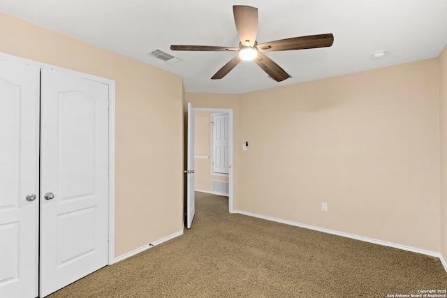 unfurnished bedroom featuring ceiling fan and carpet flooring