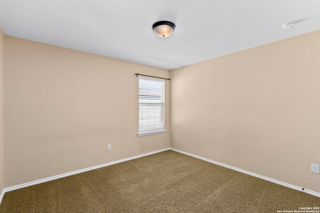 unfurnished room featuring carpet flooring