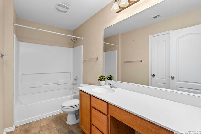 full bathroom with vanity, wood-type flooring, toilet, and shower / bath combination