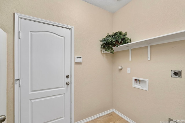 laundry room featuring hardwood / wood-style floors, hookup for a washing machine, and hookup for an electric dryer