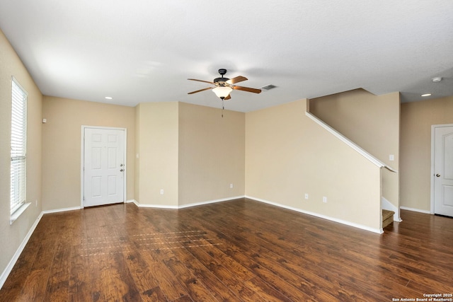 spare room featuring dark hardwood / wood-style floors and ceiling fan