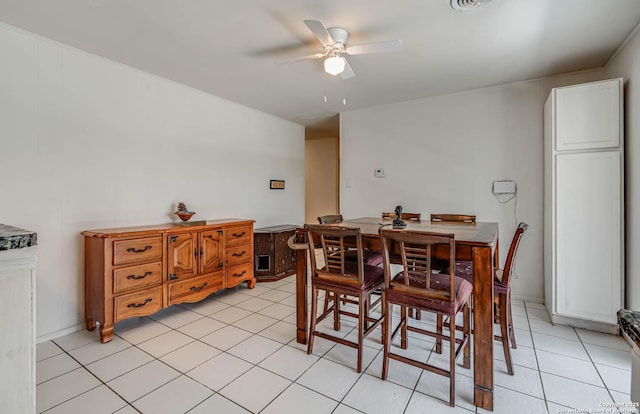 dining area with light tile patterned floors and ceiling fan