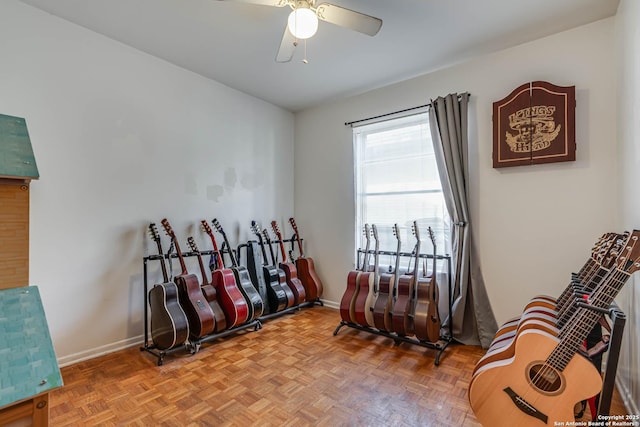 sitting room with parquet flooring and ceiling fan