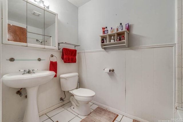 bathroom with tile patterned floors, toilet, and sink