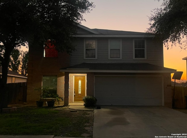 view of front of property with a garage