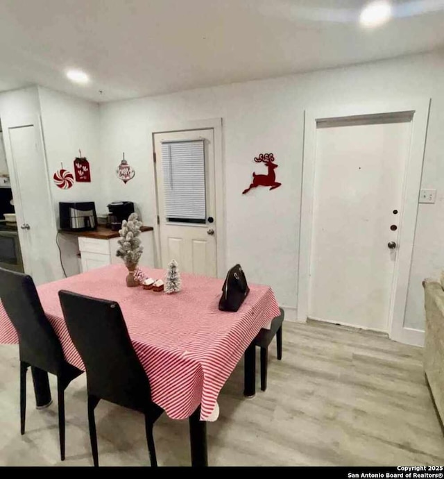 dining area with light wood-type flooring