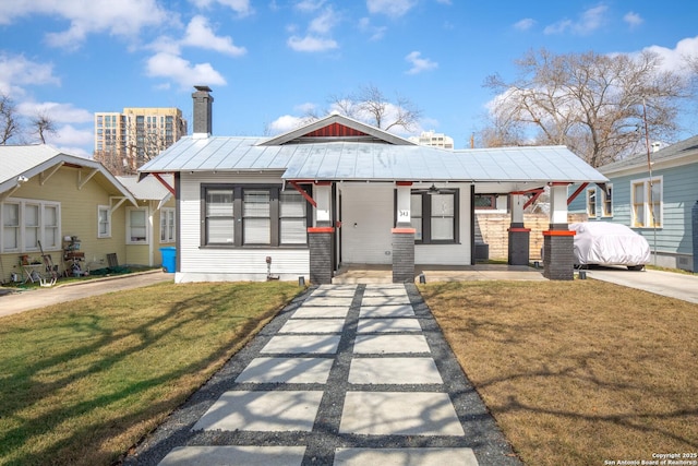 bungalow-style home with a front yard and a porch