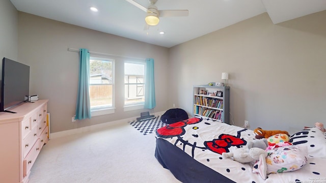 bedroom featuring ceiling fan and light colored carpet