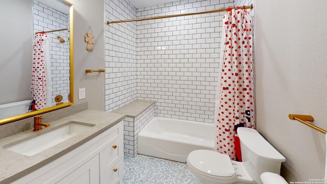 full bathroom featuring vanity, shower / bath combo with shower curtain, and toilet