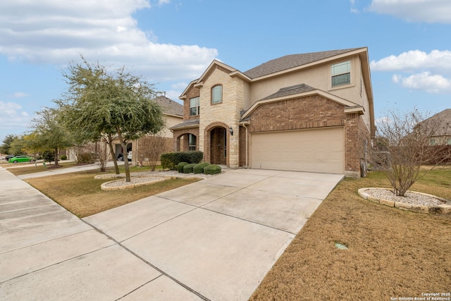 view of front facade featuring a garage and a front lawn