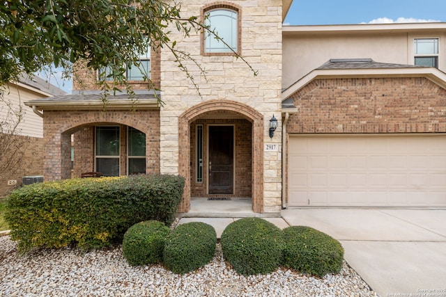 doorway to property featuring a garage