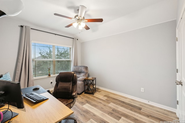 office area featuring light hardwood / wood-style flooring, ceiling fan, and vaulted ceiling