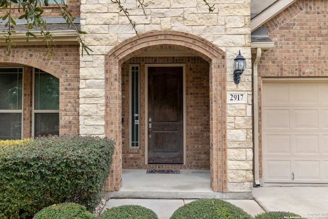 entrance to property featuring a garage