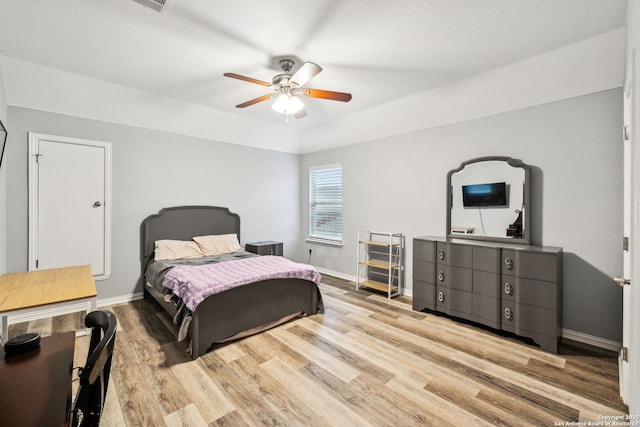 bedroom with ceiling fan and light wood-type flooring