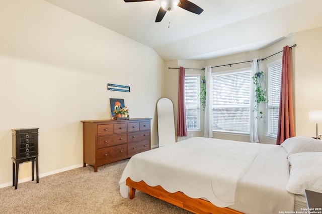 bedroom with lofted ceiling, light carpet, and ceiling fan