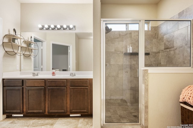 bathroom with vanity and a shower with shower door