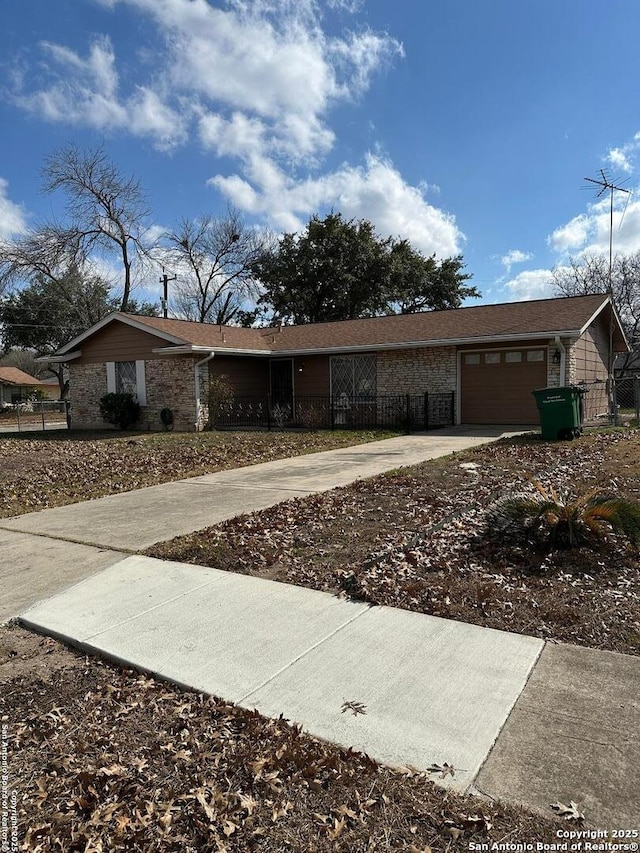 ranch-style house featuring a garage