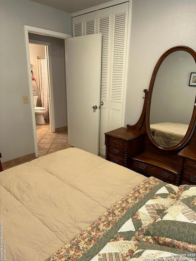 tiled bedroom with a closet