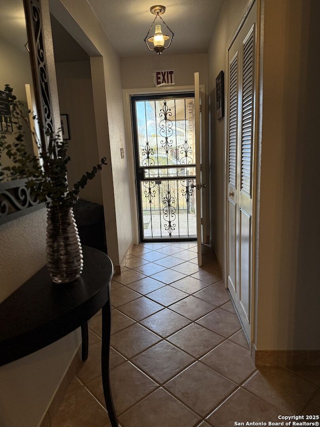 entryway with tile patterned floors